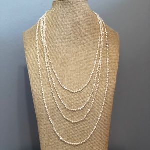 56 inch strand of cultured ivory pearls